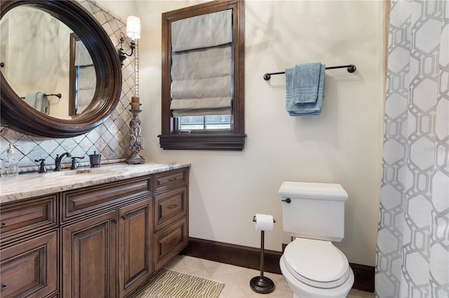 10138 Enchanted Oak Dr, Golden Oak, FL 32836 - bathroom featuring toilet, vanity, baseboards, and backsplash