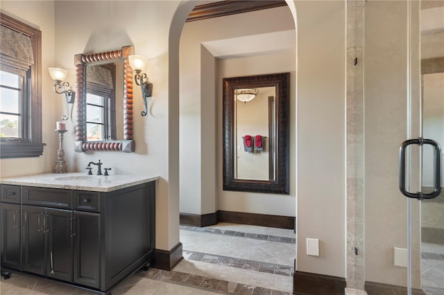 10138 Enchanted Oak Dr, Golden Oak, FL 32836 - bathroom with baseboards, a shower stall, and vanity