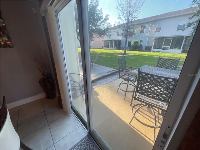 2737 Merrieweather Ln, Kissimmee, FL 34743 - doorway to outside featuring tile patterned floors and baseboards