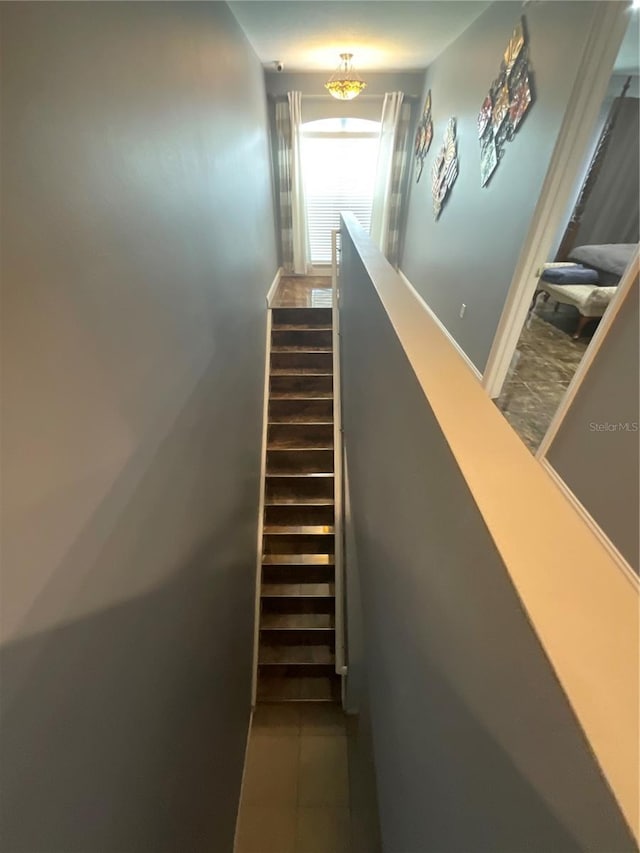 2737 Merrieweather Ln, Kissimmee, FL 34743 - stairway featuring tile patterned floors