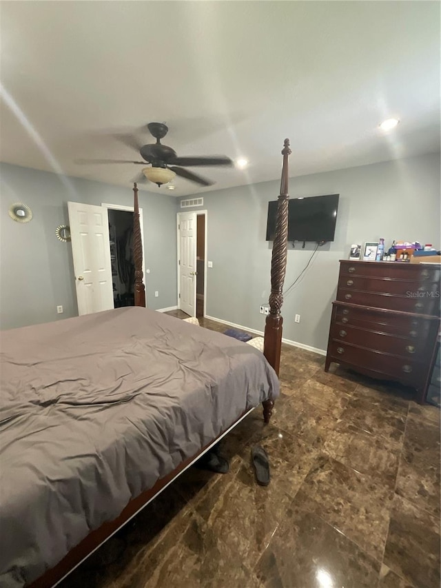2737 Merrieweather Ln, Kissimmee, FL 34743 - bedroom with baseboards, a ceiling fan, and visible vents