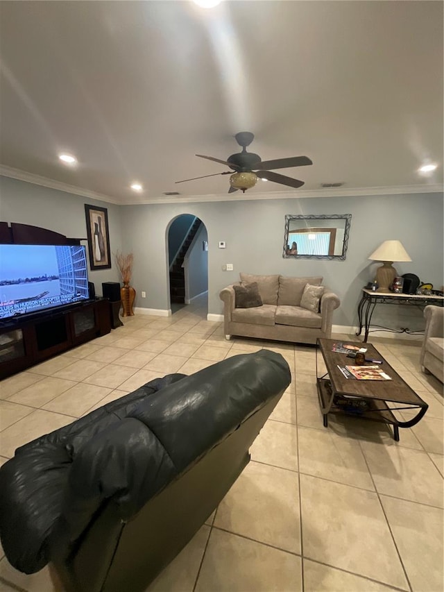 2737 Merrieweather Ln, Kissimmee, FL 34743 - tiled living area featuring arched walkways, crown molding, a ceiling fan, and recessed lighting