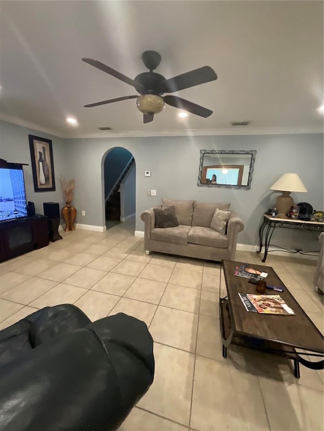 2737 Merrieweather Ln, Kissimmee, FL 34743 - living area featuring arched walkways, ceiling fan, ornamental molding, and light tile patterned flooring