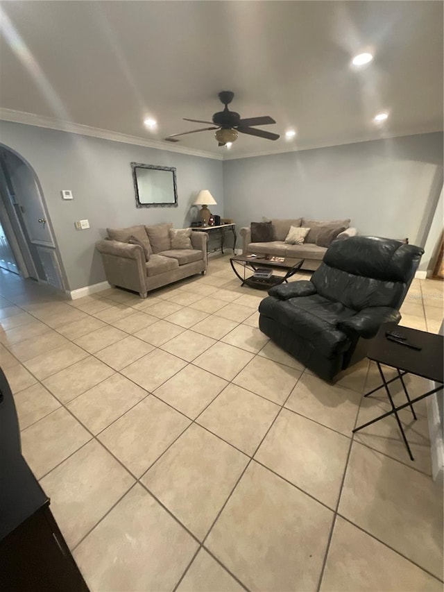 2737 Merrieweather Ln, Kissimmee, FL 34743 - living area with arched walkways, ceiling fan, crown molding, and light tile patterned flooring