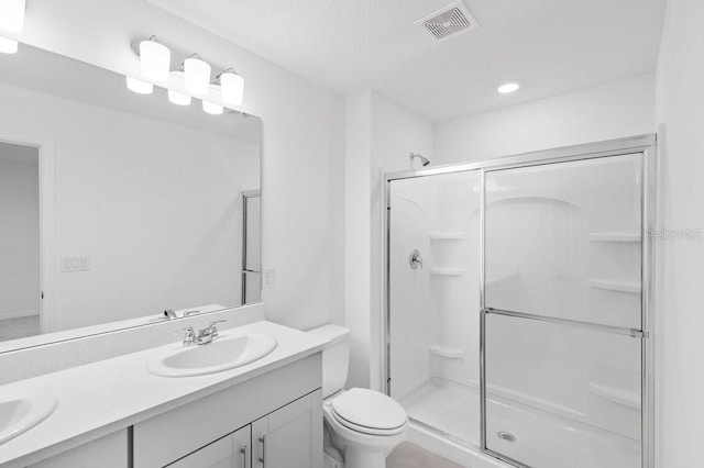 182 River Front Way, Edgewater, FL 32141 - full bathroom with visible vents, a sink, a stall shower, and toilet
