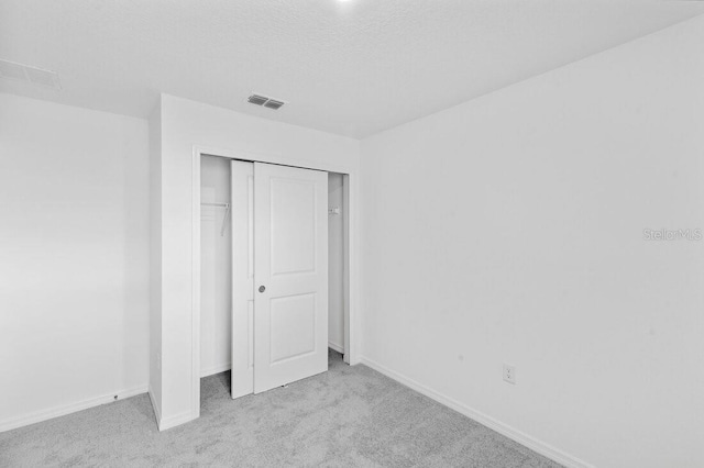 182 River Front Way, Edgewater, FL 32141 - unfurnished bedroom with baseboards, carpet, and visible vents