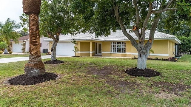 view of front of house featuring stucco siding, an attached garage, a front yard, and concrete driveway