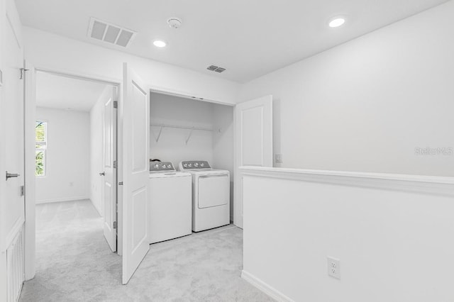 180 River Front Way, Edgewater, FL 32141 - washroom featuring laundry area, light colored carpet, and visible vents