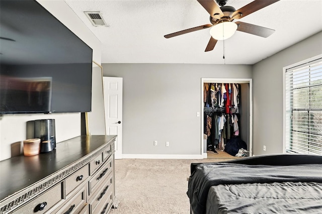 3251 Oak Lake Pl Unit 135, Winter Park, FL 32792 - carpeted bedroom with baseboards, a textured ceiling, visible vents, a ceiling fan, and a closet