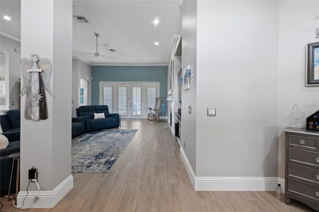10662 Woodchase Cir, Orlando, FL 32836 - hallway featuring light wood finished floors, visible vents, and ornamental molding