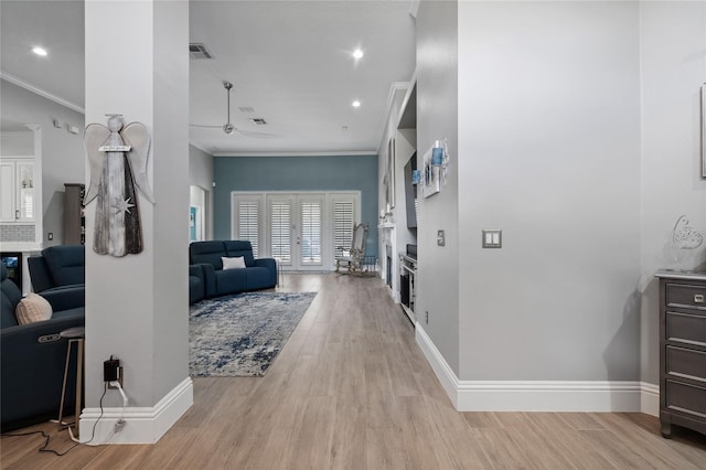 10662 Woodchase Cir, Orlando, FL 32836 - hallway featuring light wood finished floors, baseboards, visible vents, and crown molding