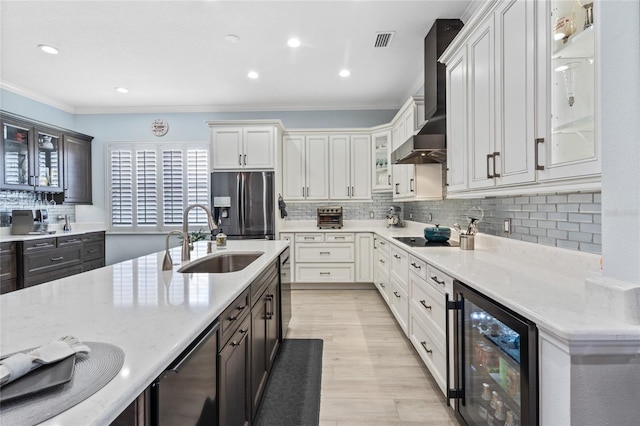 10662 Woodchase Cir, Orlando, FL 32836 - kitchen with stainless steel fridge with ice dispenser, a sink, beverage cooler, visible vents, and wall chimney range hood