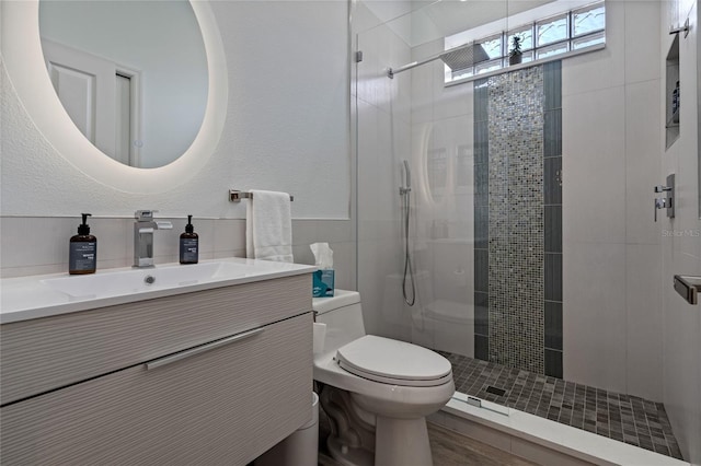 10662 Woodchase Cir, Orlando, FL 32836 - bathroom with a textured wall, toilet, a stall shower, and vanity