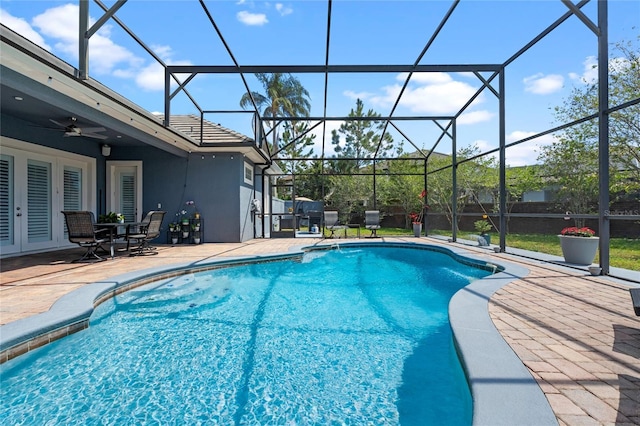 10662 Woodchase Cir, Orlando, FL 32836 - outdoor pool with french doors, a lanai, ceiling fan, and a patio