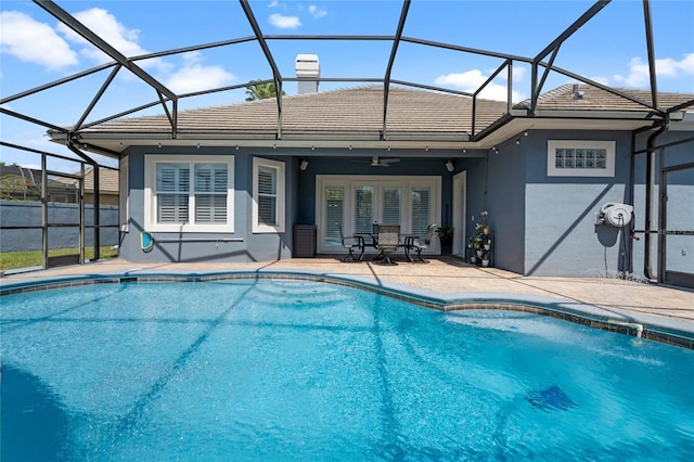 10662 Woodchase Cir, Orlando, FL 32836 - outdoor pool featuring glass enclosure, ceiling fan, and a patio