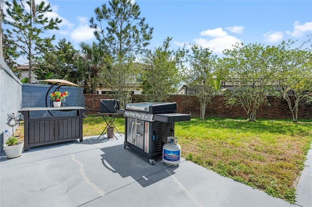 10662 Woodchase Cir, Orlando, FL 32836 - view of patio / terrace with a grill and fence