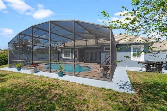 10662 Woodchase Cir, Orlando, FL 32836 - back of property with cooling unit, a patio, a fenced in pool, glass enclosure, and a lawn