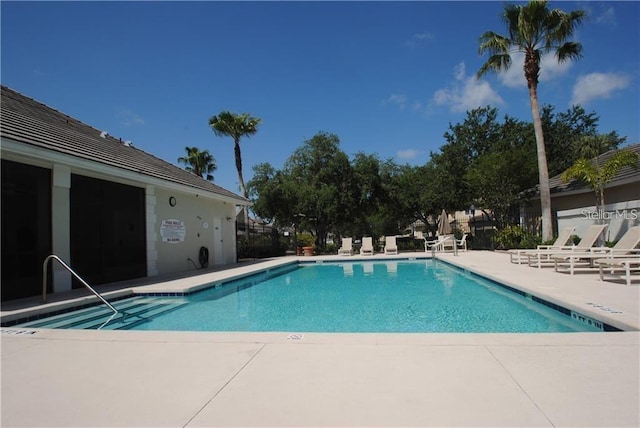 10662 Woodchase Cir, Orlando, FL 32836 - pool featuring a patio and fence