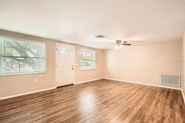 entryway with ceiling fan, wood finished floors, and visible vents