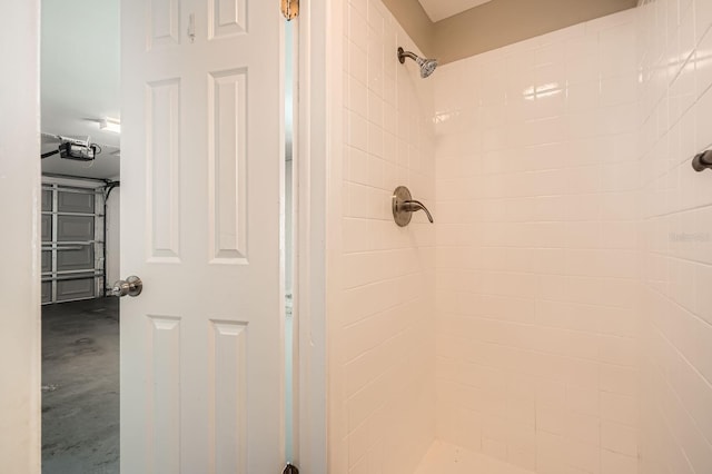 bathroom with concrete floors and a stall shower