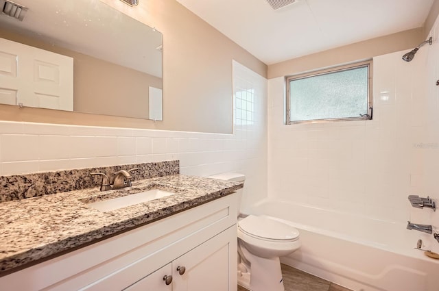 bathroom with visible vents, shower / bath combination, toilet, and vanity
