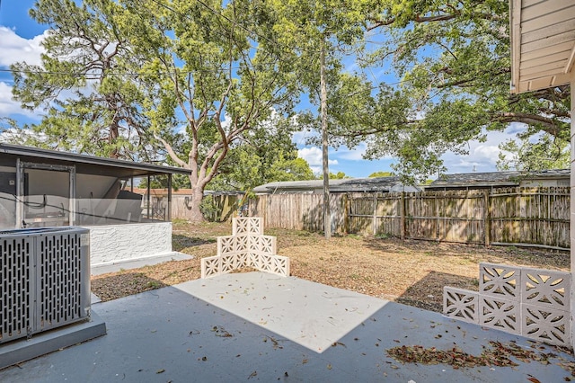 view of yard featuring central air condition unit, a patio, and a fenced backyard