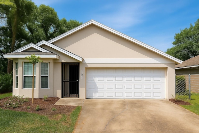 101 Dovetail Ct, Apopka, FL 32703 - ranch-style home featuring stucco siding, driveway, and a garage
