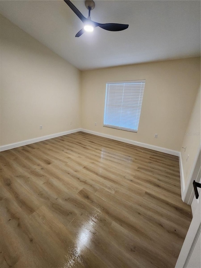 101 Dovetail Ct, Apopka, FL 32703 - unfurnished room with wood finished floors, a ceiling fan, and baseboards