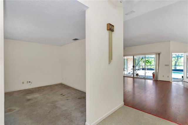 unfurnished room featuring baseboards, visible vents, and tile patterned floors