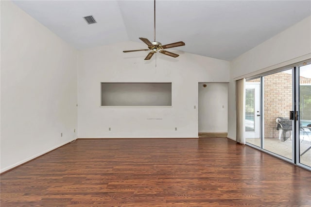 unfurnished room with lofted ceiling, baseboards, visible vents, a ceiling fan, and wood finished floors