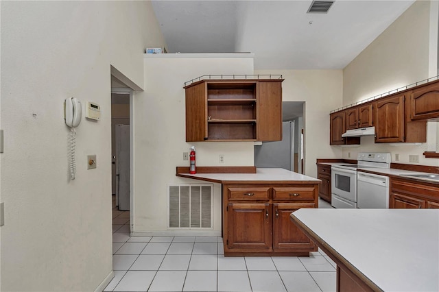 kitchen with under cabinet range hood, white appliances, open shelves, and visible vents
