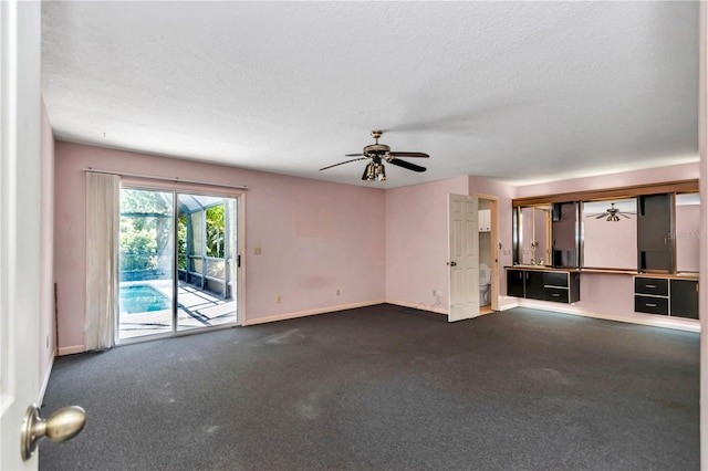 unfurnished living room featuring baseboards, carpet flooring, a textured ceiling, and a ceiling fan