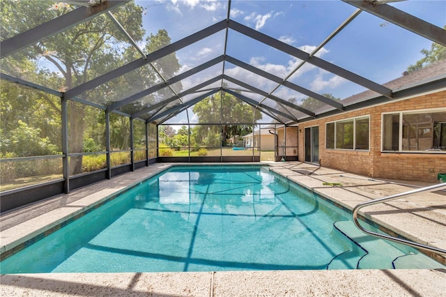 outdoor pool featuring a patio and a lanai