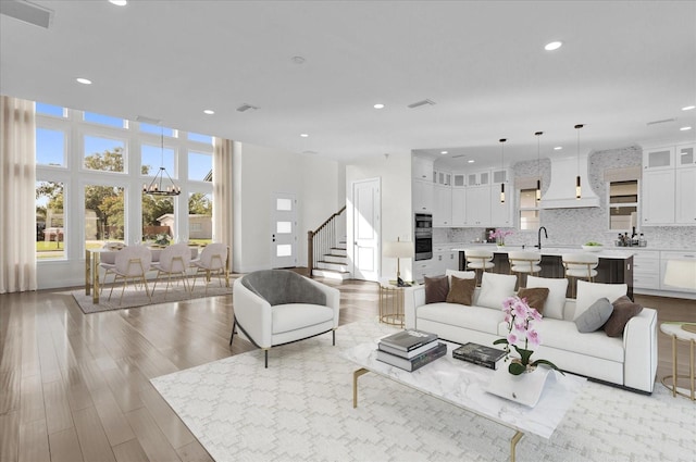 4405 Rockledge Rd, Orlando, FL 32807 - living area with visible vents, recessed lighting, wood finished floors, and stairway