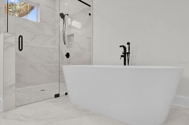 4405 Rockledge Rd, Orlando, FL 32807 - full bathroom with marble finish floor, a marble finish shower, and a freestanding tub