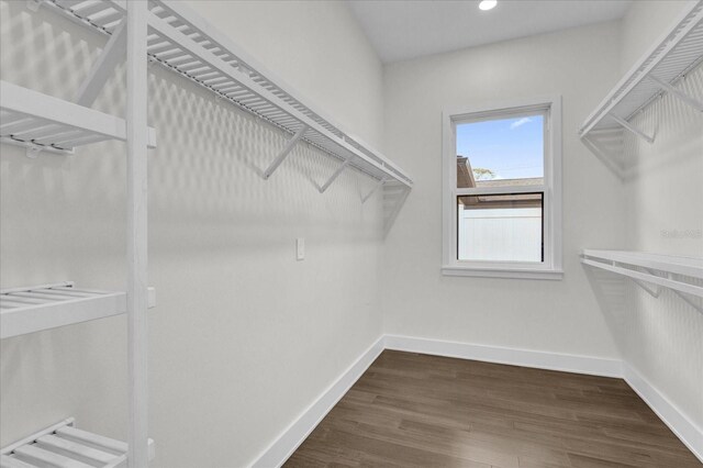4405 Rockledge Rd, Orlando, FL 32807 - walk in closet with dark wood-style floors