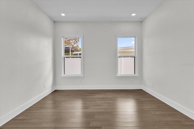 4405 Rockledge Rd, Orlando, FL 32807 - unfurnished room with baseboards, recessed lighting, and dark wood-type flooring