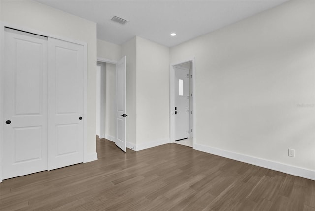 4405 Rockledge Rd, Orlando, FL 32807 - unfurnished bedroom with a closet, wood finished floors, baseboards, visible vents, and recessed lighting