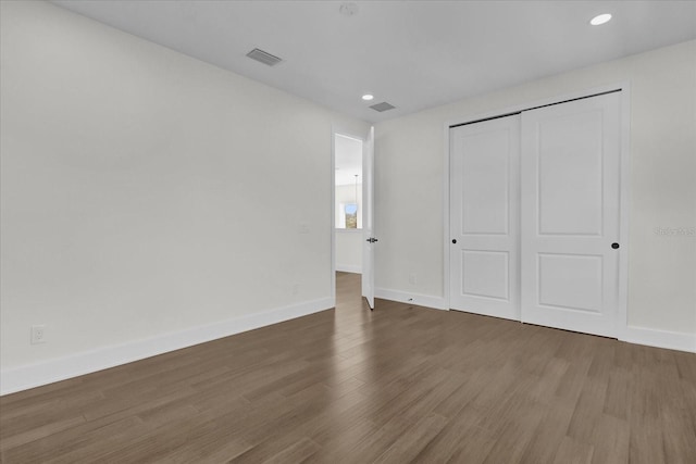 4405 Rockledge Rd, Orlando, FL 32807 - unfurnished bedroom featuring baseboards, visible vents, and wood finished floors