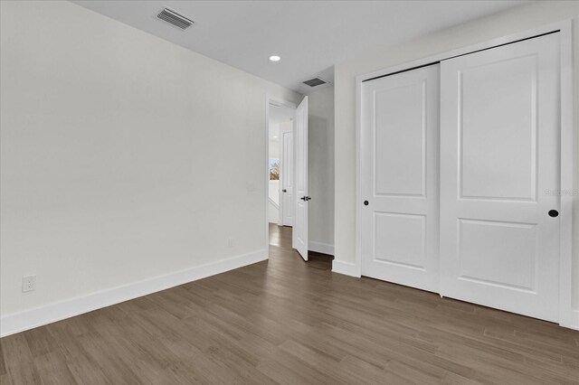 4405 Rockledge Rd, Orlando, FL 32807 - unfurnished bedroom featuring baseboards, visible vents, and wood finished floors