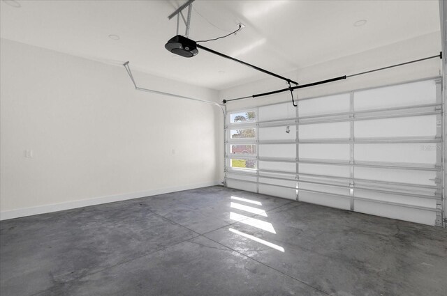 4405 Rockledge Rd, Orlando, FL 32807 - garage with a garage door opener and baseboards