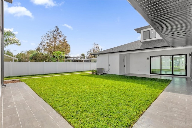 4405 Rockledge Rd, Orlando, FL 32807 - view of yard featuring a fenced backyard, a patio, and central AC unit