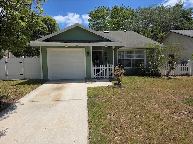 ranch-style house featuring a front lawn, fence, a gate, concrete driveway, and an attached garage