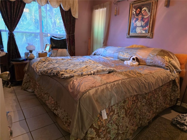 bedroom featuring light tile patterned floors