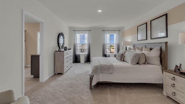 bedroom featuring light colored carpet