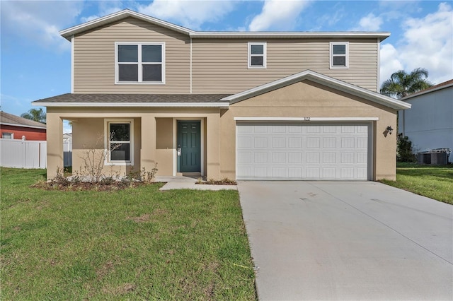 1032 Cannock Dr, Kissimmee, FL 34758 - traditional-style house featuring driveway, stucco siding, fence, and a front lawn