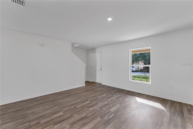1032 Cannock Dr, Kissimmee, FL 34758 - spare room featuring baseboards, visible vents, wood finished floors, and recessed lighting
