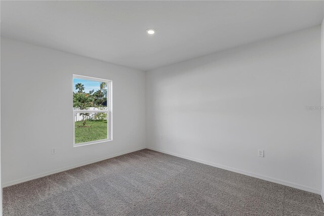 1032 Cannock Dr, Kissimmee, FL 34758 - spare room featuring baseboards, carpet floors, and recessed lighting