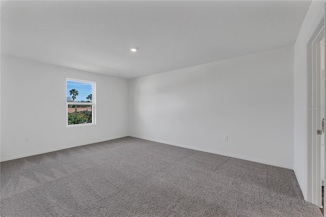 1032 Cannock Dr, Kissimmee, FL 34758 - spare room featuring baseboards and carpet floors