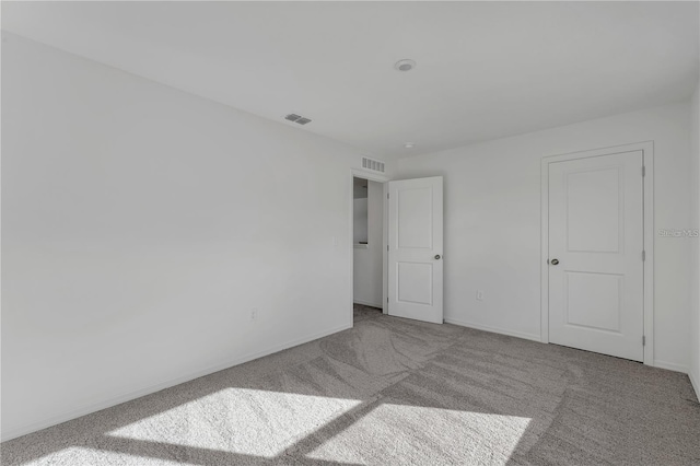 1032 Cannock Dr, Kissimmee, FL 34758 - unfurnished bedroom featuring carpet flooring, baseboards, and visible vents